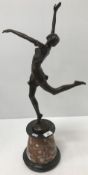 A bronze figure of a young girl dancing inscribed 