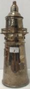 A plated cocktail shaker in the form of a lighthouse, stamped 