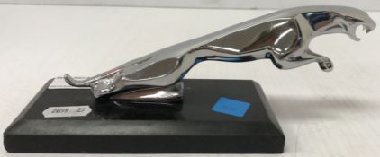A modern chromed Jaguar style car mascot, raised on a plinth base, 20 cm long x 7.