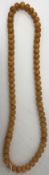 An amber beaded necklace,
