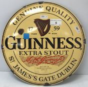 A Guinness enamelled advertising sign of circular form, 29.