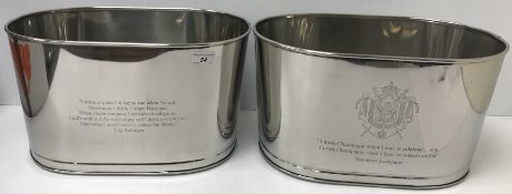 A pair of modern metal champagne coolers of tablet form inscribed 