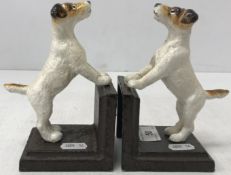 A pair of painted cast metal book ends in the form of Terriers, tallest 10.