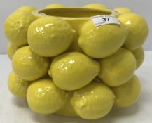 A jardiniere / plant pot with applied lemon decoration throughout,