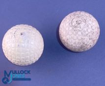 2x interesting half and half Golf balls showing a recess pattern on one half and raised square