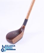 Alex Patrick Perfector patent applied for dark stained persimmon driver showing the exposed short