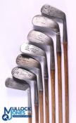 7x Assorted irons with varying lofts - to incl' Fred Stephens shield marked mashie, J Moffat own
