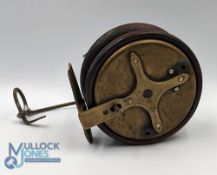 A scarce cone brass and mahogany star back reel, 3 3/8