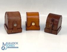 A collection of block leather 'D' shape reel cases, as follows: Unnamed green lined 3.5