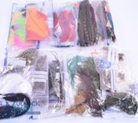 A collection of fly tying feathers comprising: Jay, pheasant, partridge, mallard, marabou, teal