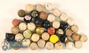 Quantity of mainly modern dimple golf balls including few wrapped Dunlop 65 examples