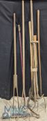 A collection of Antique and later garden tools including 2x wooden rakes, long handle scythes, hoes,