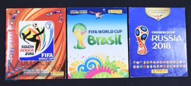 Three complete Panini World Cup Sticker Albums 2010, 2014 and 2018 in good condition with some small