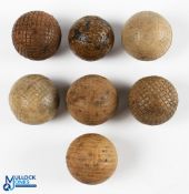 7x Rubber practice golf balls - 6x with mesh markings the other with circular patterns