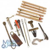 A collection of random fishing tools and gadgets: 2x pipe cleaners. Cummins waistcoat fly oiler.