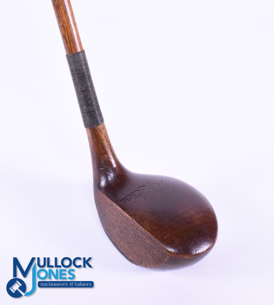 Large head left handed Brassie in dark stained persimmon stamped Ernest W le Fevre with attractively
