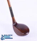 Large head left handed Brassie in dark stained persimmon stamped Ernest W le Fevre with attractively