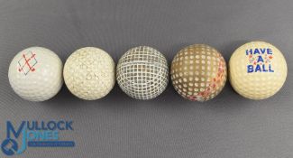 Collection of various made golf balls (5) to include replica square line gutty golf ball stamped