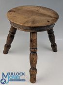 A Period Yew Wood Stool, well-turned seat with three angled turned feet supports. Height 23cm,