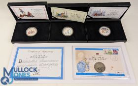 The Beatrix Potter Peter Rabbit Coin Sets. Christmas Wreath Silver Medal, Easter Wreath Silver