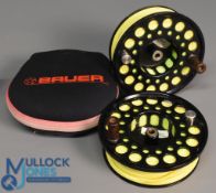 2x Bauer Spare Spools in black model unknown but measures 112mm across face 110mm backplate, 30mm