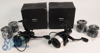 Pair of Sonik Vader X 6000FS spinning reels with spare spools in black finish, both appear in