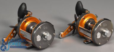 Pair of ABU Garcia Ambassadeur 6500 C3CTMag multiplier reels in metallic silver/orange finish,