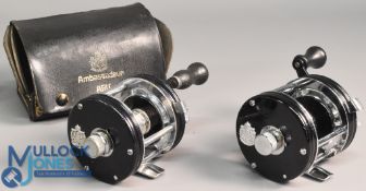 2x ABU Ambassadeur 5000C multiplier reels - both in black finish, feet stamped 730101and 850100 - 1x