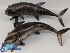 Two Articulated white metal Models of Fish, with green glass eyes, stamped '250', possibly Indian,