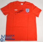 Geoff Hurst Signed England replica football shirt in red, signed in black ink to the front, short