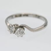 A diamond two stone cross over ring, set in 18ct white gold, size Q