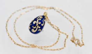 Fabergé, an 18ct gold and enamelled egg pendant set with diamonds, from a limited edition stamped on