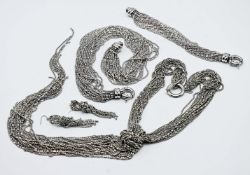 A Coast necklace and earring set together with another necklace and bracelet set.