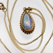 Green Pear Opal pendant with lots of fire & colour set in a rub over setting with twisted wire