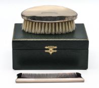Beautiful brand new green cased grooming set comprising oval silver topped brush and silver spined