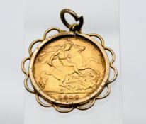 A 1910 Edward VII half sovereign, mounted, approx. 5.5g total.