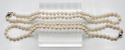 Two matching pair of single row uniform cultured pearl necklaces, approx. length: 46cm, pearl