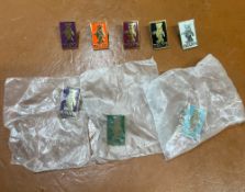 An assortment of eight Dean's Rag Book Bears enamel pins in various colours.