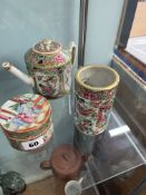 An Oriental porcelain Cantonese small teapot together with a box and cover and a pierced cylindrical