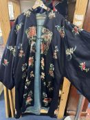 An embroidered silk robe, first half 20th century, of A-line shape with side splits and a central