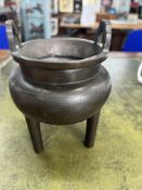 A Chinese bronze censor with etched decoration on the bowl and feet, with ring handles, height 12cm,