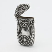 An ornate silver Vesta, height 65mm