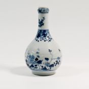 A blue and white garlic neck bottle vase, 18th century. The globular body painted with blossoming