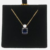 A sapphire and diamond globe pendant on fine chain by Tru Diamonds