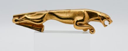 Automobilia: a vintage Jaguar car mascot, with gilt finish, length 18.5cm