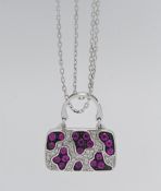Iliana- an 18k white gold ruby and diamond pendant in the form of a bag, approx. 9.6g, with