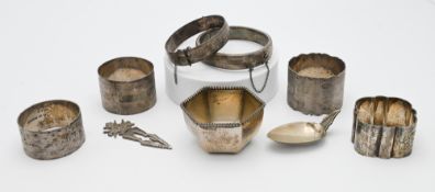 Four silver napkin rings, small sterling silver bowl with inscription 1994, silver bracelets and