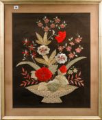 A pair of embroidered pictures of flowers arranged in jardinieres (mounted, framed and glazed) 85.