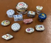 A collection of eleven small ceramic pill boxes mainly Del Prado.