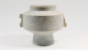 A white-glazed jar, 20th century, the broad cylindrical body on a tall splayed foot and moulded with